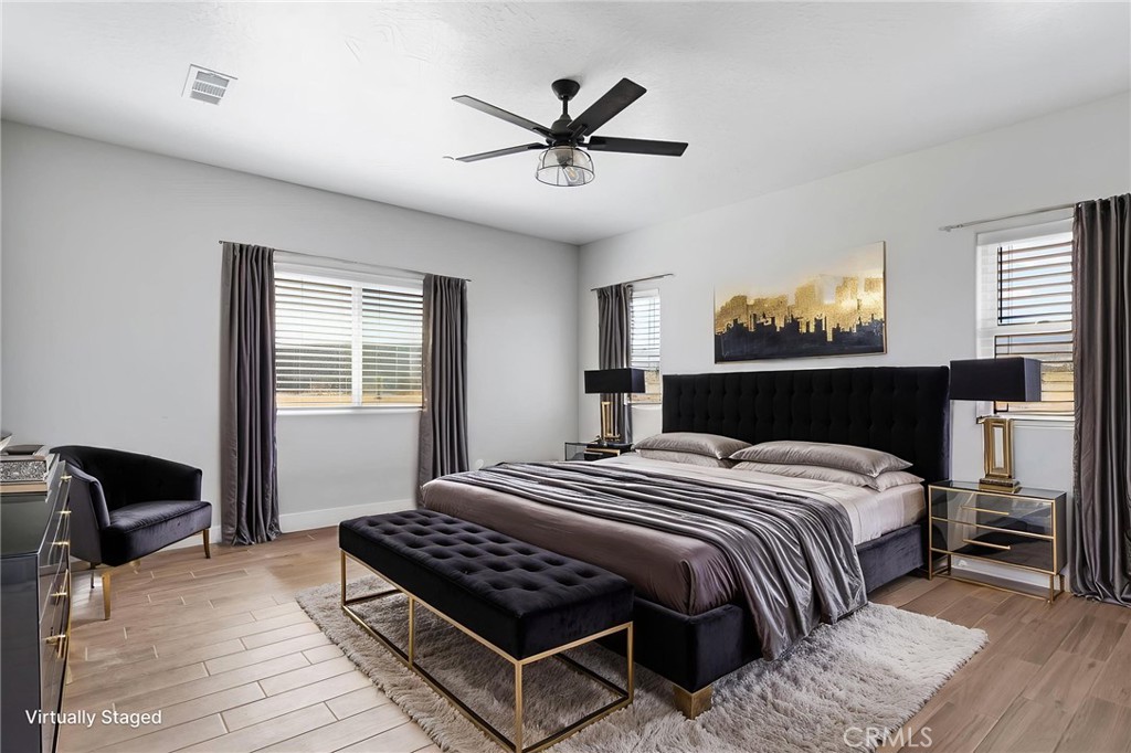 10055 Eaby Road Phelan, CA 92371 - Photo 19 of 19 a bedroom with a bed and window