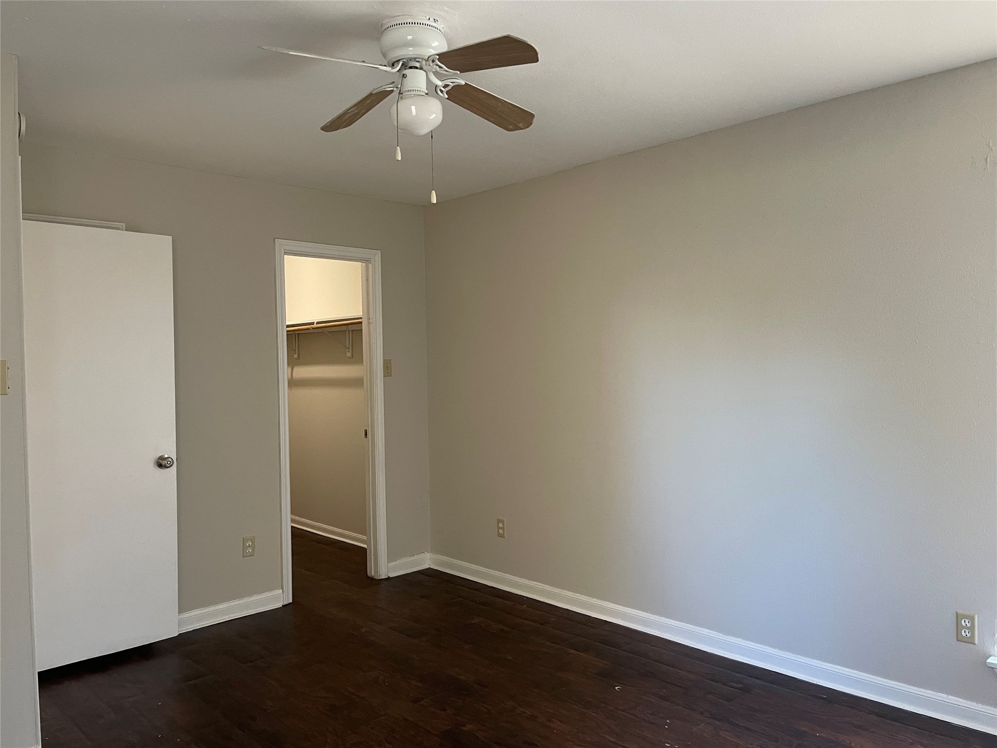 7715 Rolling Ridge Drive Houston, TX 77072 - Photo 3 of 6 an empty room with wooden floor closet and windows