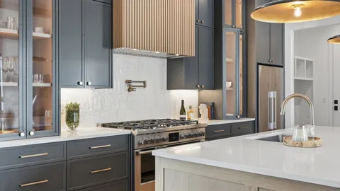 a kitchen with stainless steel appliances granite countertop a sink and a stove