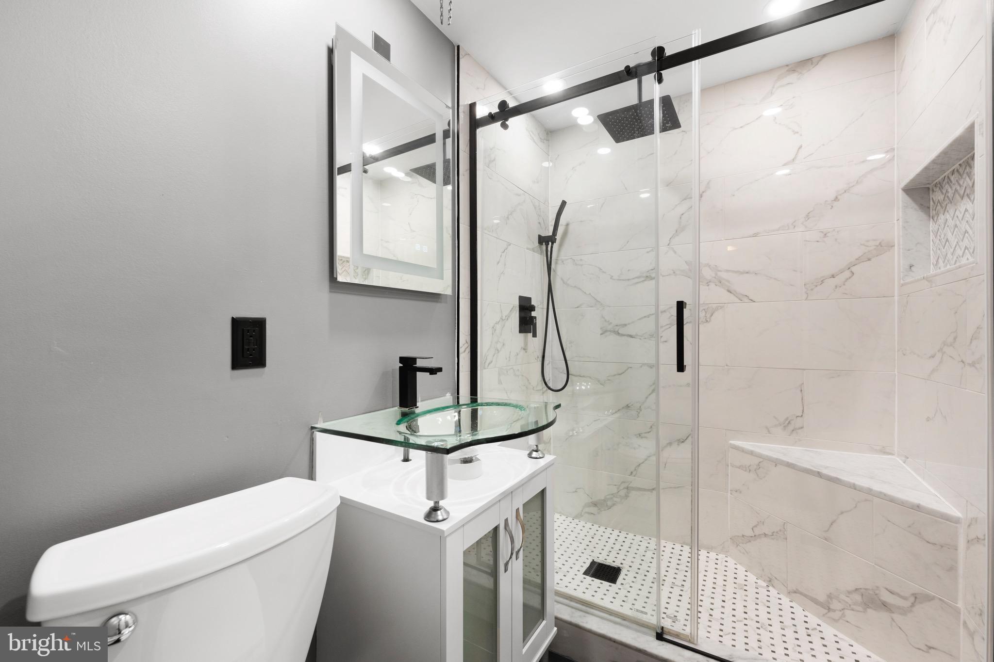 3210 Morning Glory Road Philadelphia, PA 19154 - Photo 13 of 24 a bathroom with a shower toilet and sink
