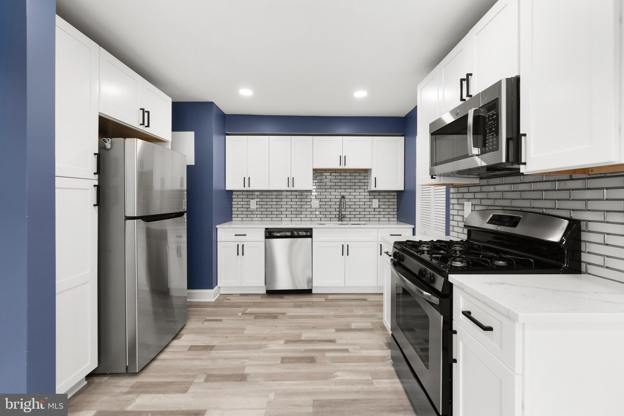 3210 Morning Glory Road Philadelphia, PA 19154 - Photo 5 of 24 a kitchen with stainless steel appliances a refrigerator sink and microwave