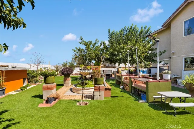 a view of a backyard with sitting area