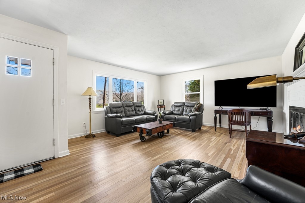 6540 Som Center Road Solon, OH 44139 - Photo 4 of 27 Spacious living room features a cozy wood-burning fireplace
