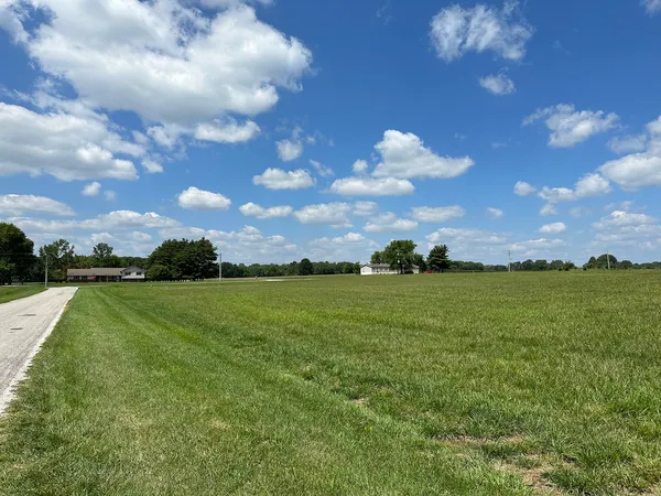 a view of field with ocean