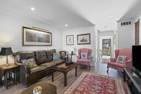 a living room with furniture and a rug
