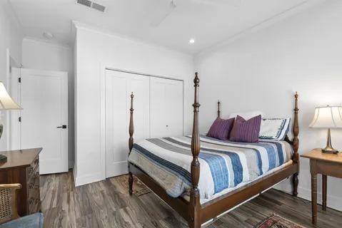 a bed room with a bed and a night stand