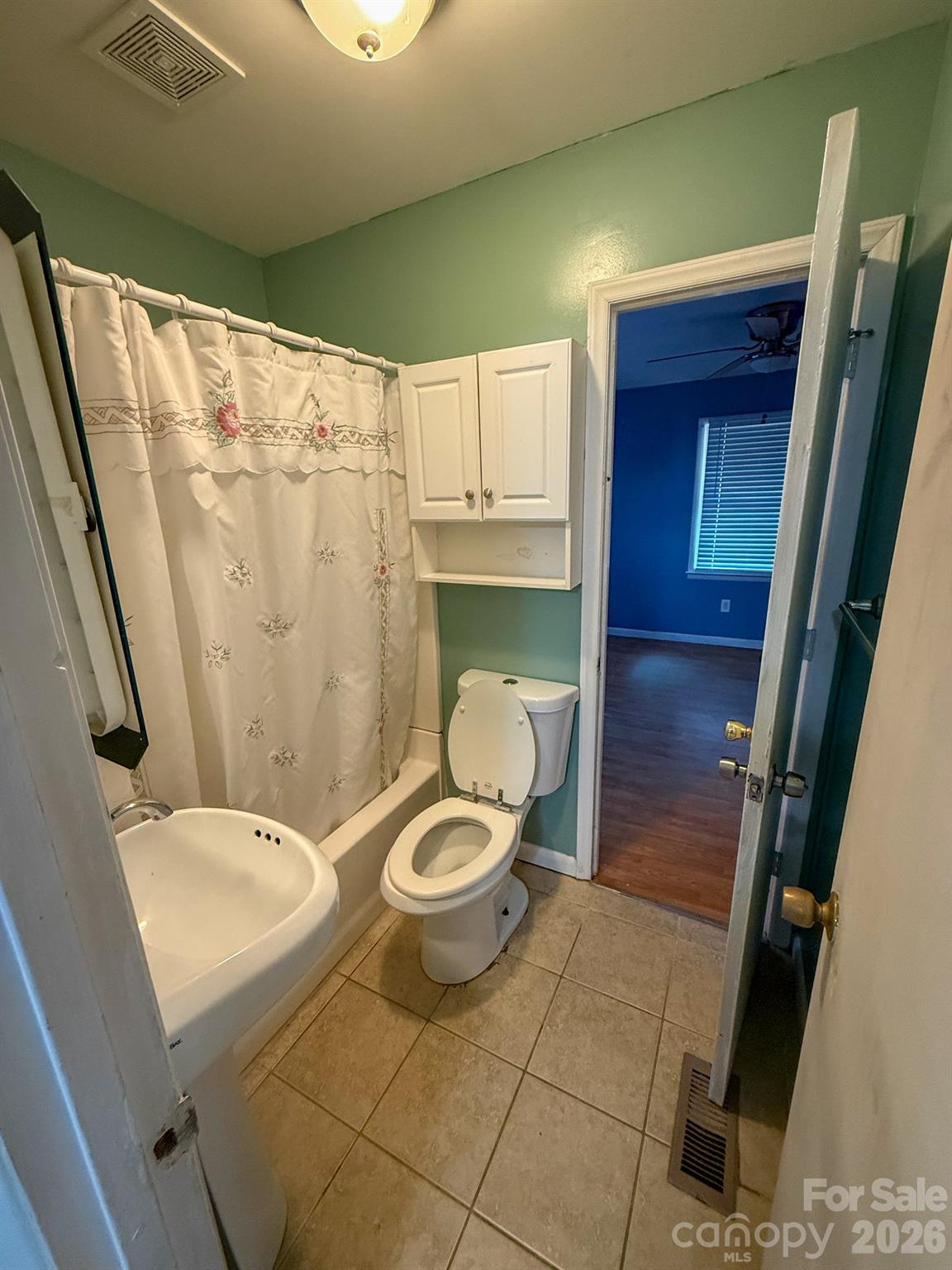 483 Caribou Road Asheville, NC 28803 - Photo 18 of 26 a bathroom with a sink and a mirror