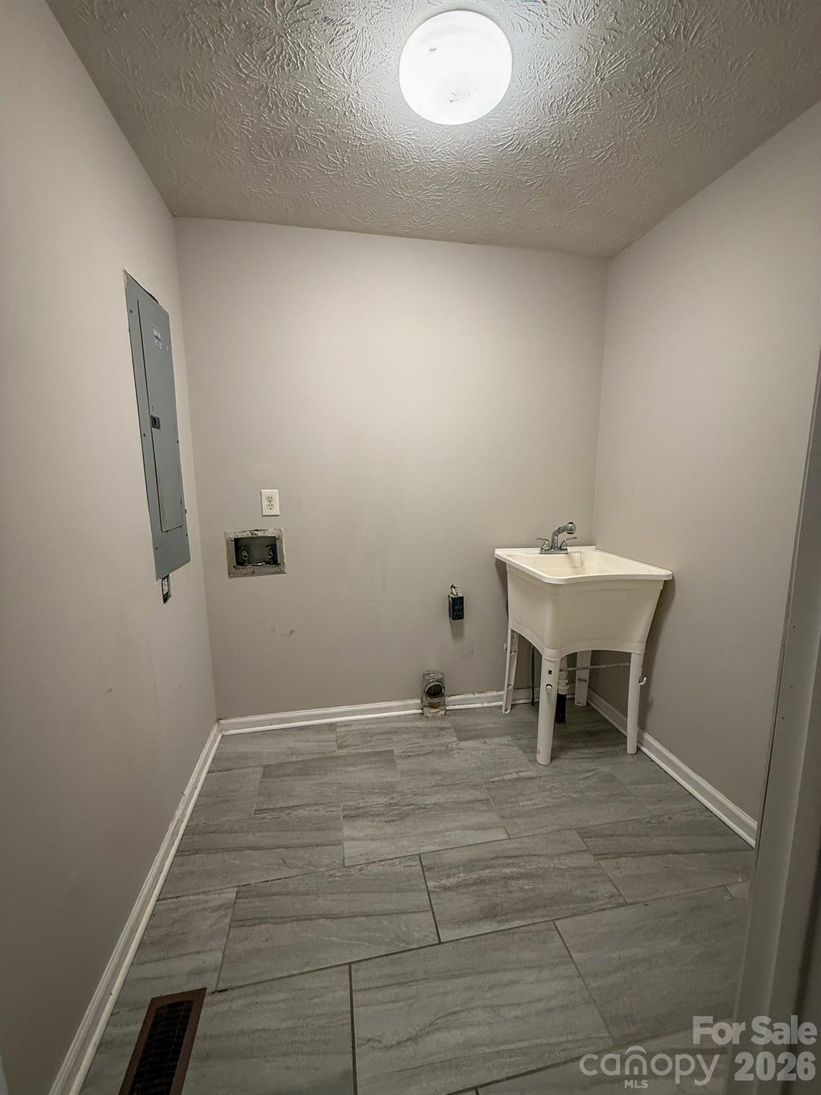 483 Caribou Road Asheville, NC 28803 - Photo 19 of 26 a view of a room with wooden floor and furniture