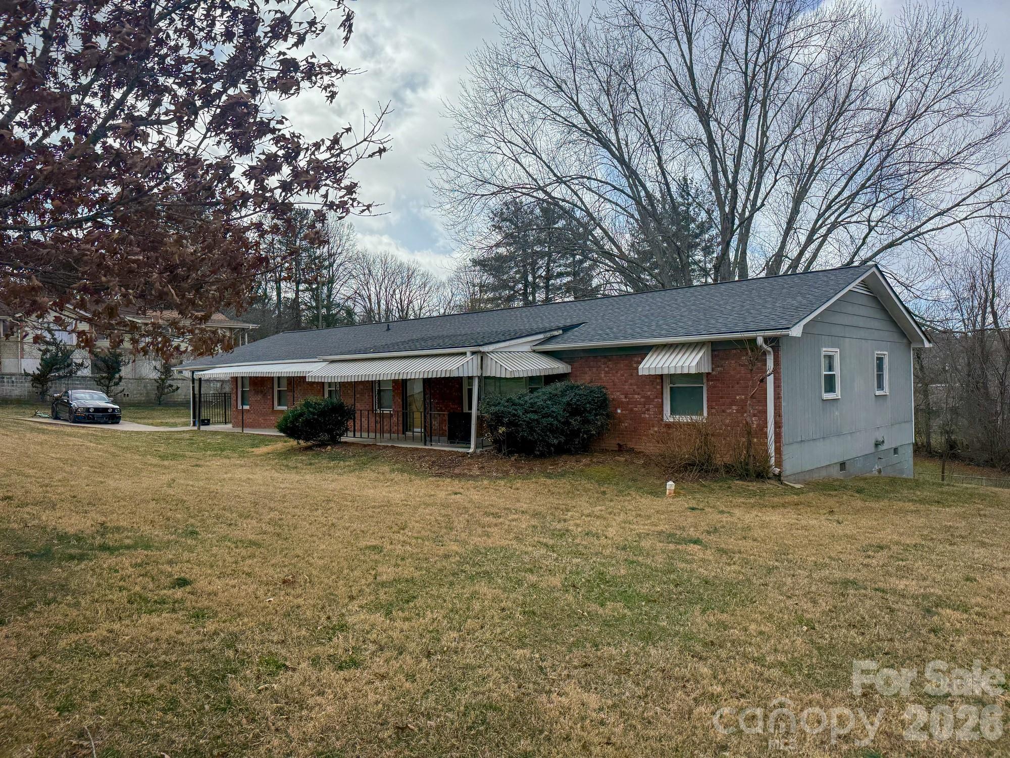 483 Caribou Road Asheville, NC 28803 - Photo 2 of 26 a view of a house with a yard