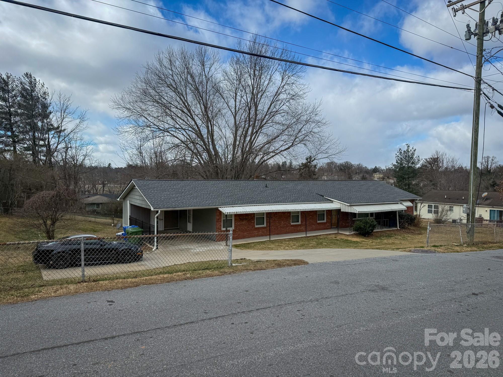 483 Caribou Road Asheville, NC 28803 - Photo 6 of 26 a view of house with outdoor space and parking