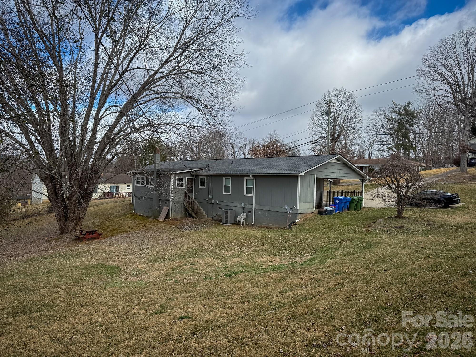 483 Caribou Road Asheville, NC 28803 - Photo 7 of 26 a view of a house with a yard