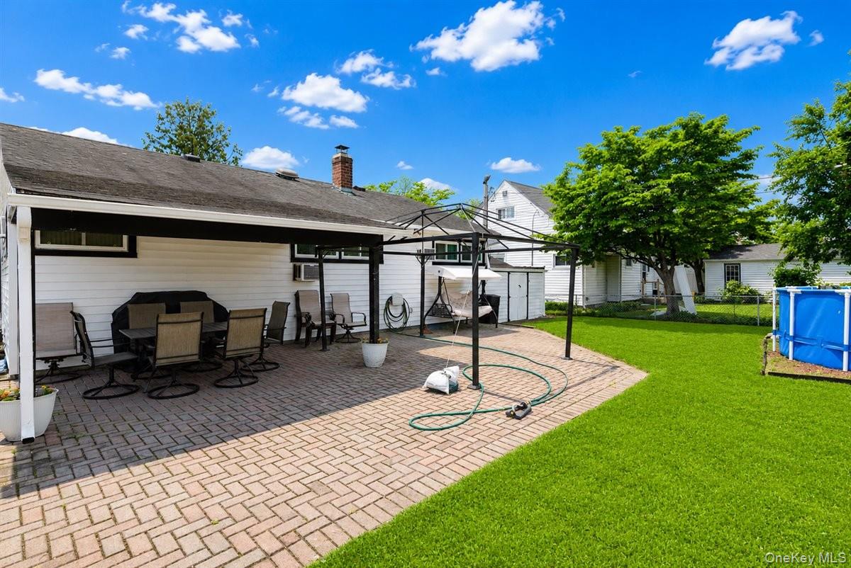 11 Adelphi Road Hicksville, NY 11801 - Photo 23 of 26 a front view of a house with garden