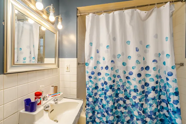 a living room with furniture and large windows