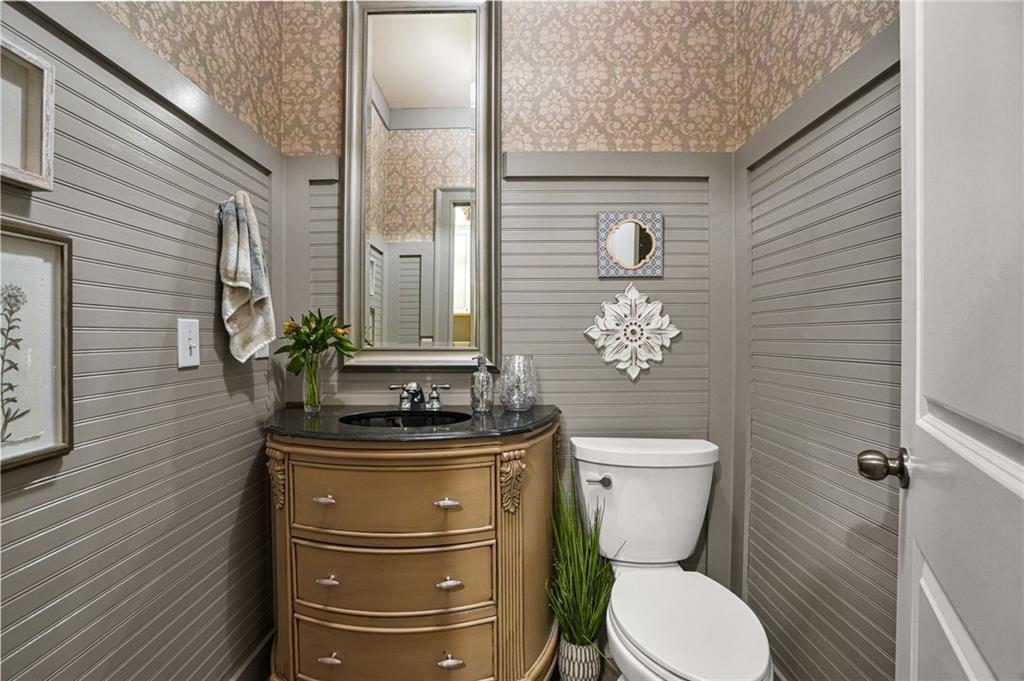 509 Crested Hawk Ridge Canton, GA 30114 - Photo 24 of 89 a bathroom with a toilet a sink and mirror