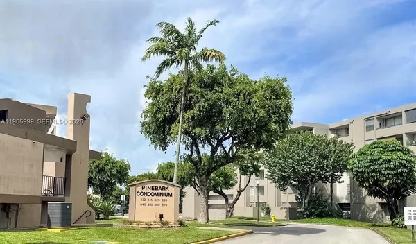 a view of a palm trees front of a building