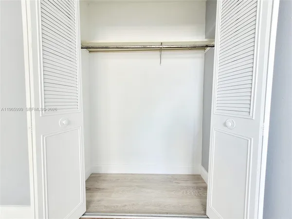 a view of an empty walk in closet