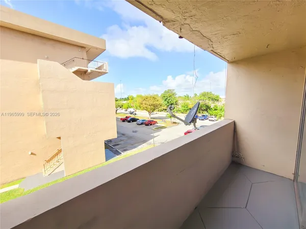 a view of balcony with wooden floor