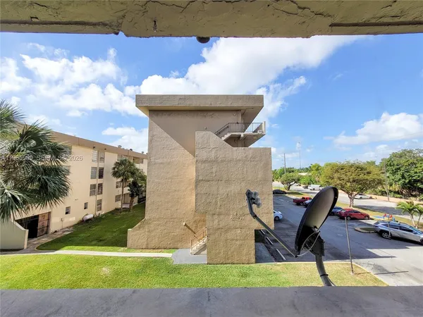 a view of a terrace with chairs and a fire pit