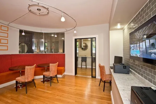 a living room with furniture a rug and a fireplace