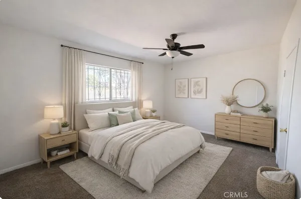a living room with furniture a window and a chair