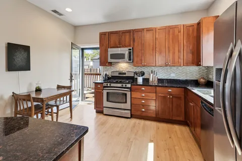 a kitchen with a stove and a microwave