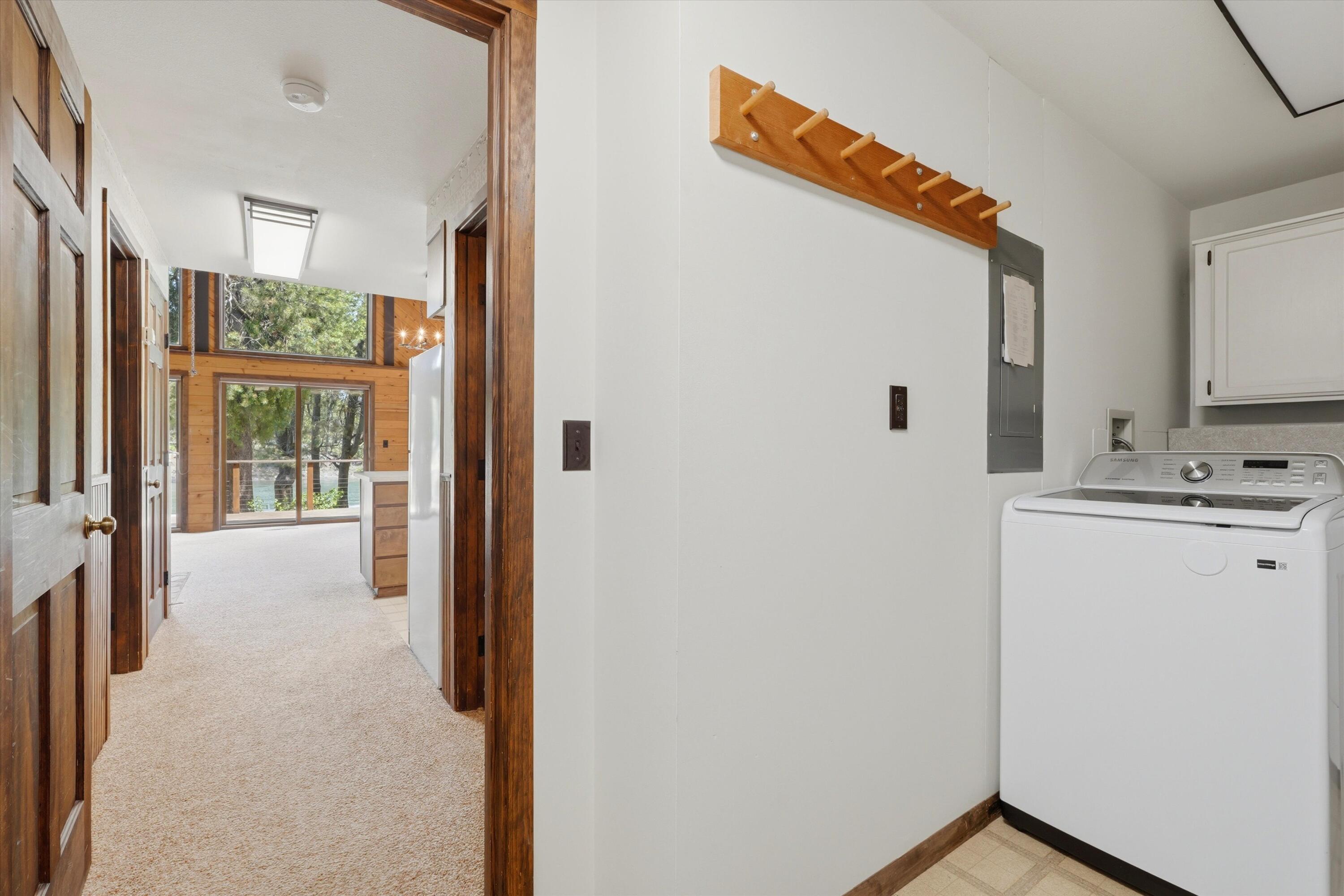 56446 Eclipse Drive Bend, OR 97707 - Photo 34 of 42 a view of a hallway with bathroom and wooden floor