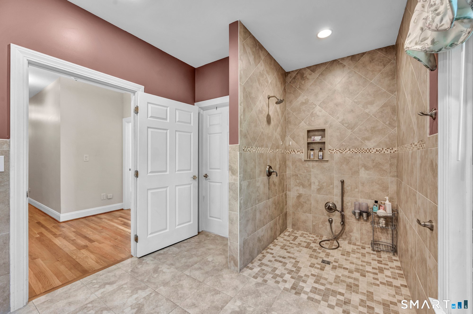 270 Copper Ridge Southington, CT 06489 - Photo 29 of 40 Large, fully wheelchair-accessible bathroom featuring a roll-under sink, roll-in shower, grab bars, and dual shower controls designed for both seated and standing positions.