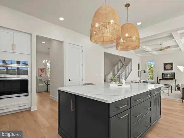 a bathroom with a sink a toilet a mirror a vanity and shower