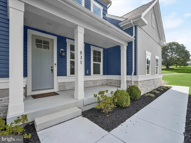 a view of living room filled with furniture and window