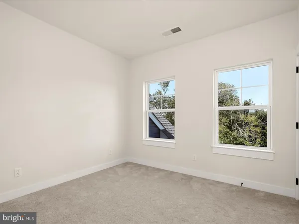 an aerial view of a residential houses with outdoor space and garden