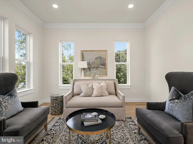 a view of a livingroom with furniture and windows