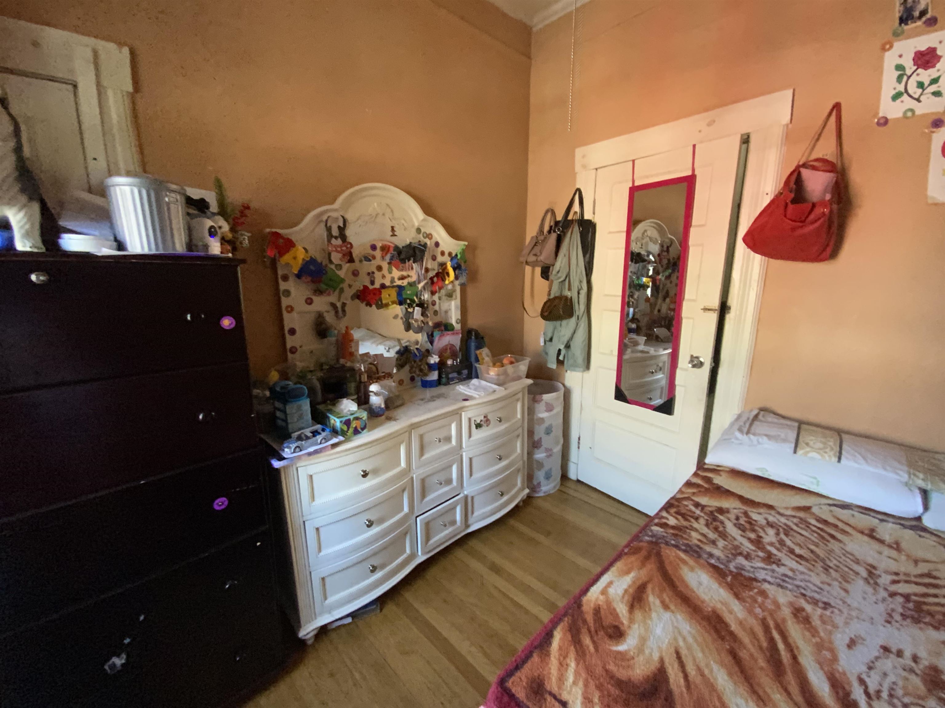 143 64th Street West New York, NJ 07093 - Photo 12 of 16 a bedroom with a bed and a dresser