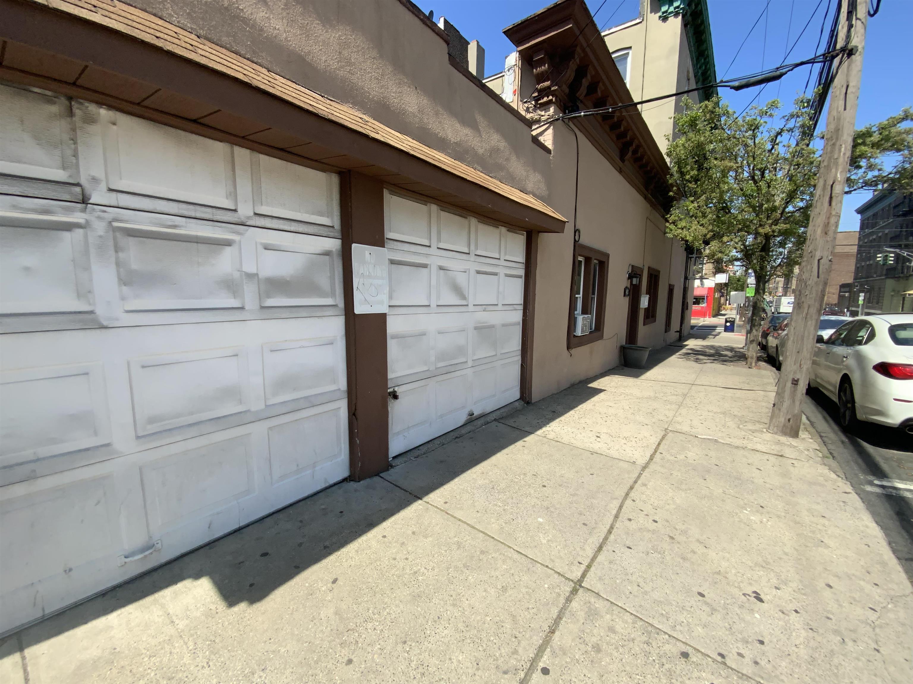 143 64th Street West New York, NJ 07093 - Photo 3 of 16 a view of a car garage door