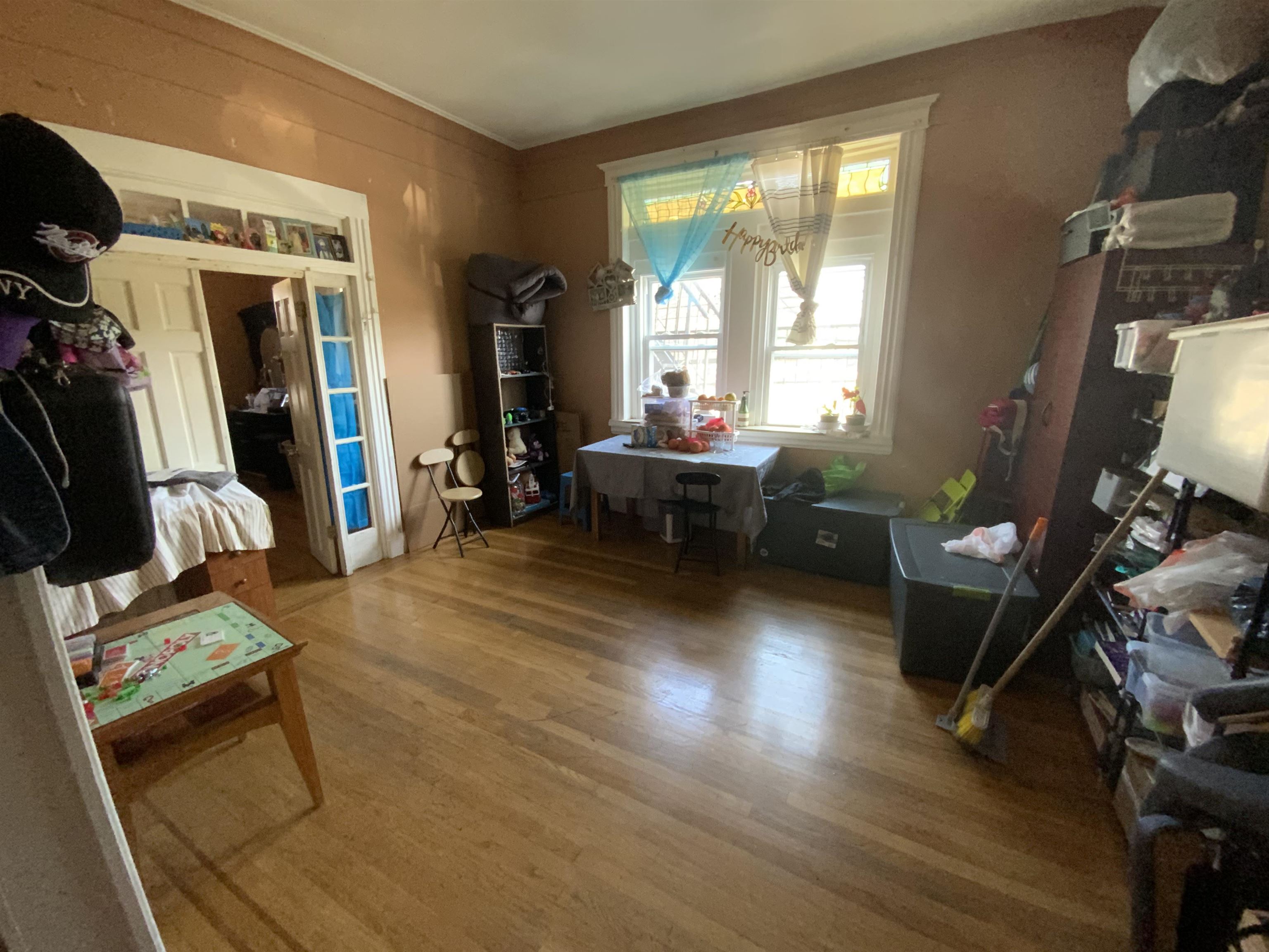 143 64th Street West New York, NJ 07093 - Photo 5 of 16 a living room with furniture and a window