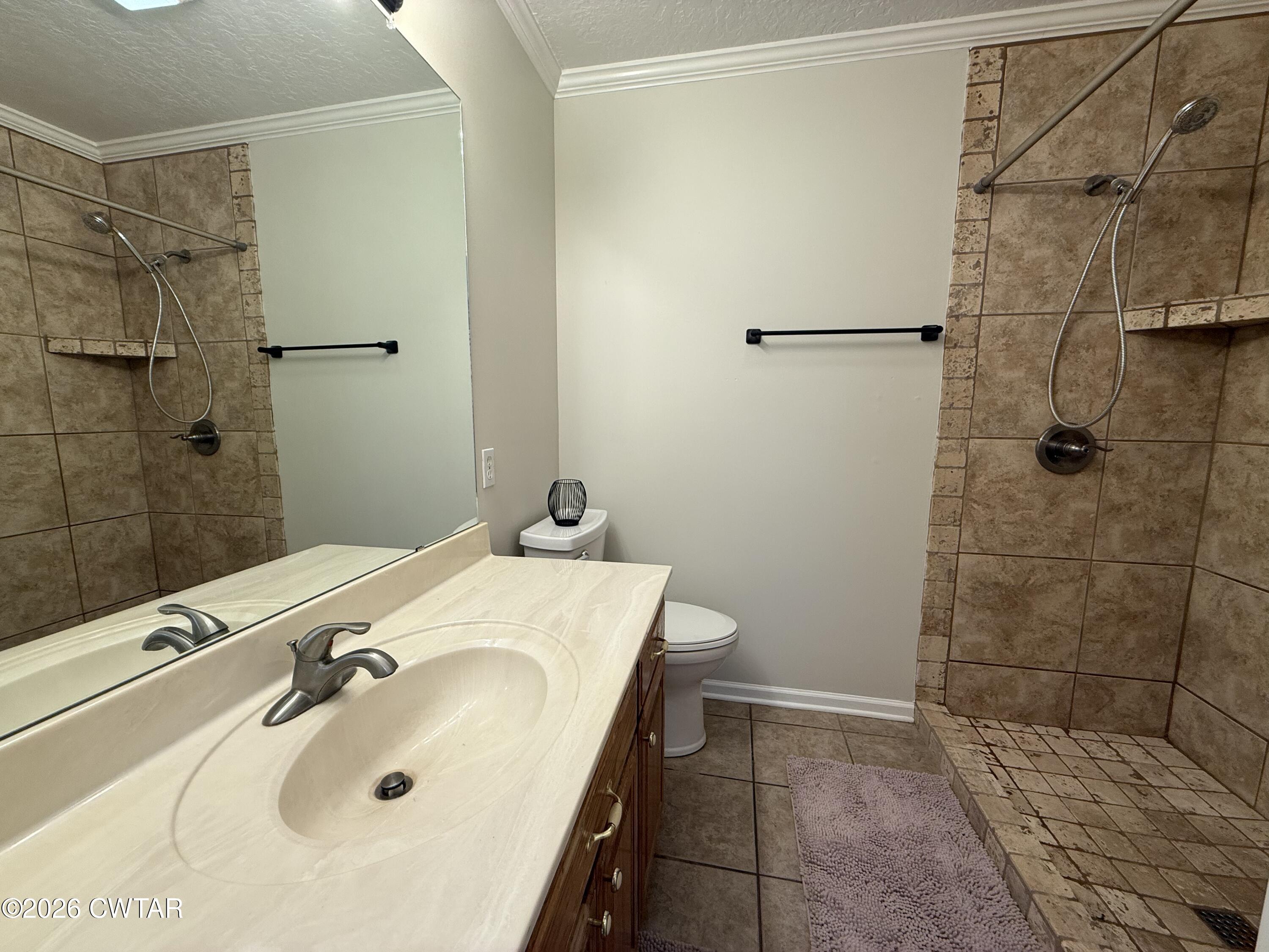 126 Waldunn Cove Rutherford, TN 38369 - Photo 12 of 18 a bathroom with a sink and shower