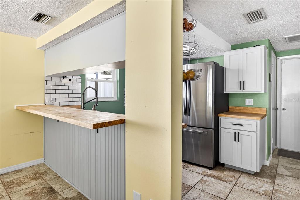 7325 Neva Lane Port Richey, FL 34668 - Photo 15 of 36 a kitchen with stainless steel appliances granite countertop a refrigerator and a stove