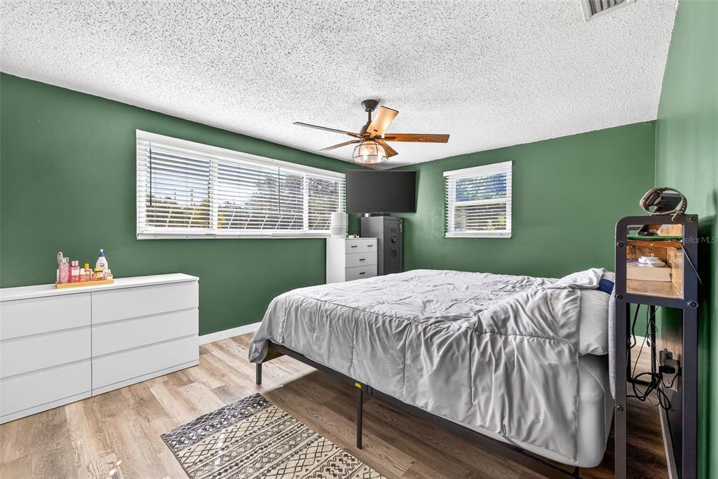 7325 Neva Lane Port Richey, FL 34668 - Photo 27 of 36 a bedroom with a bed and a window