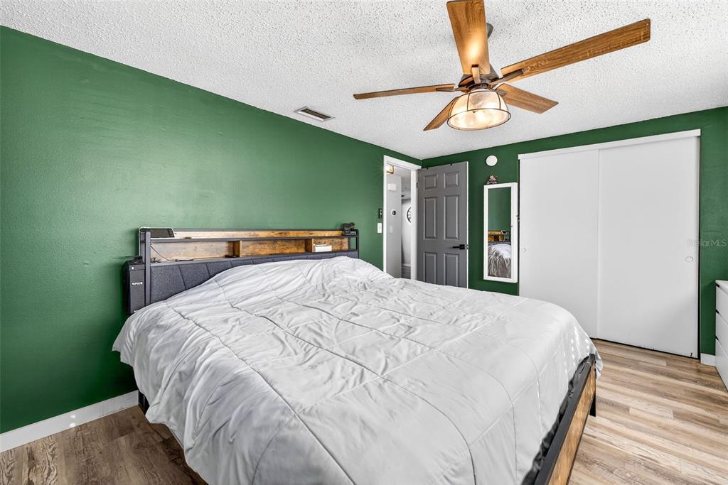 7325 Neva Lane Port Richey, FL 34668 - Photo 28 of 36 a large bed sitting in a bedroom next to a window