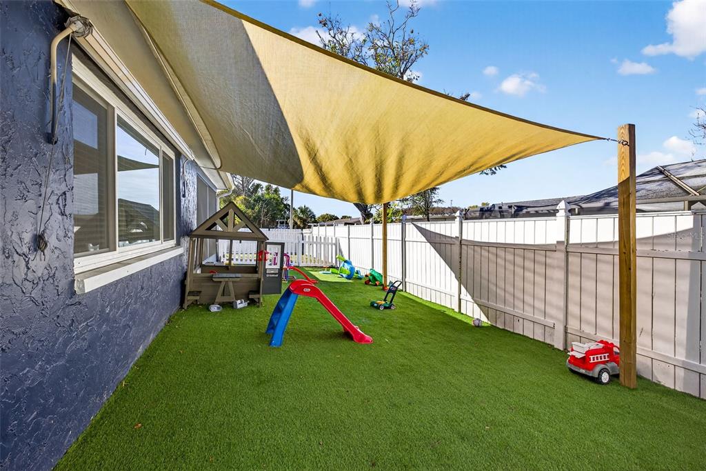 7325 Neva Lane Port Richey, FL 34668 - Photo 3 of 36 a view of a backyard with swimming pool