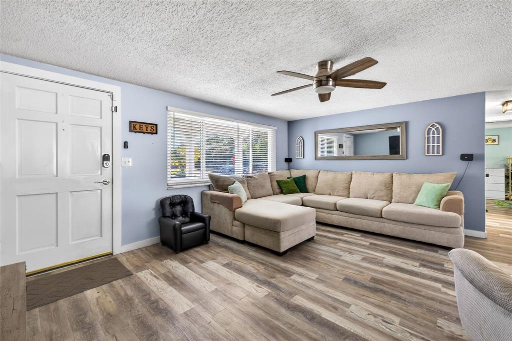 7325 Neva Lane Port Richey, FL 34668 - Photo 34 of 36 a living room with furniture and a window