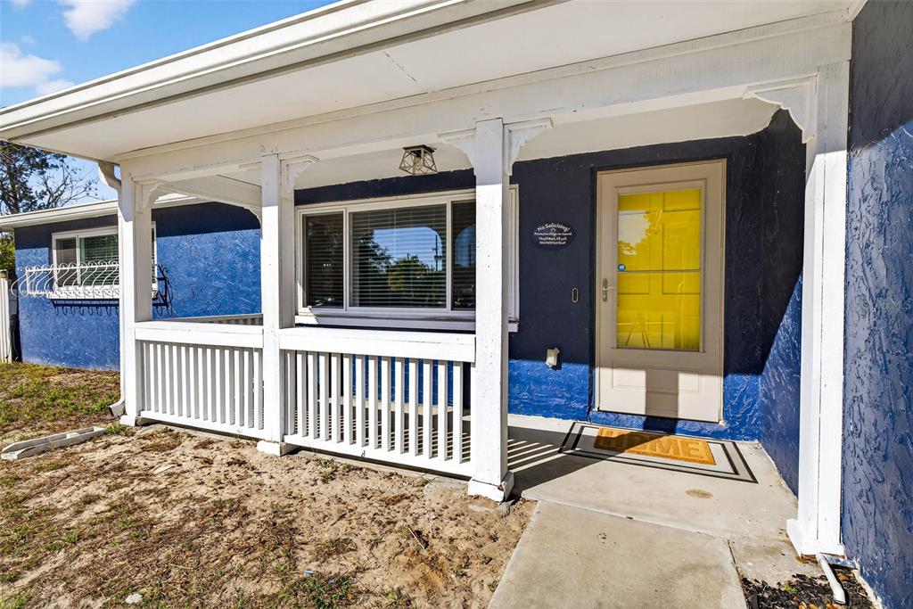 7325 Neva Lane Port Richey, FL 34668 - Photo 35 of 36 a front view of a house with a porch