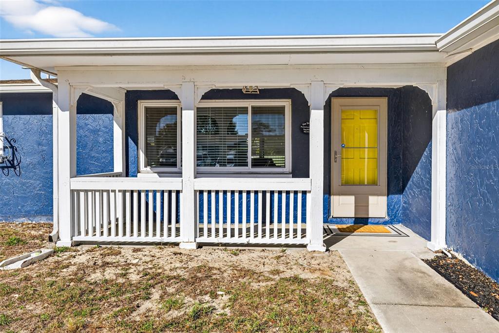 7325 Neva Lane Port Richey, FL 34668 - Photo 36 of 36 a view of a house with a porch
