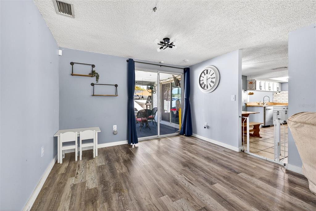 7325 Neva Lane Port Richey, FL 34668 - Photo 8 of 36 a view of a room with furniture and wooden floor