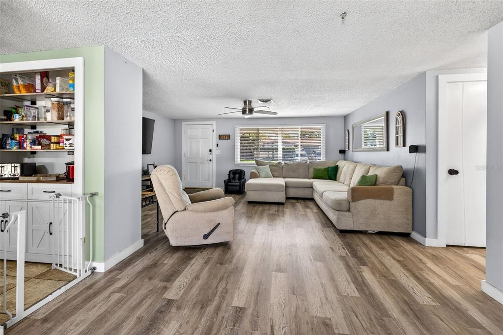 7325 Neva Lane Port Richey, FL 34668 - Photo 9 of 36 a living room with furniture and a large window