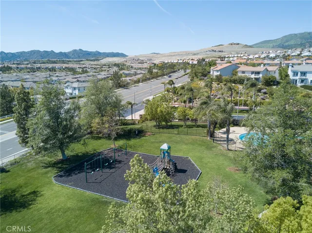 an aerial view of a house with yard