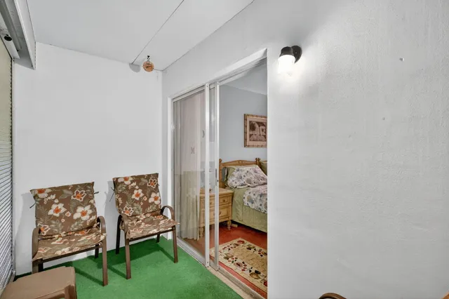 a bedroom with furniture and a gate