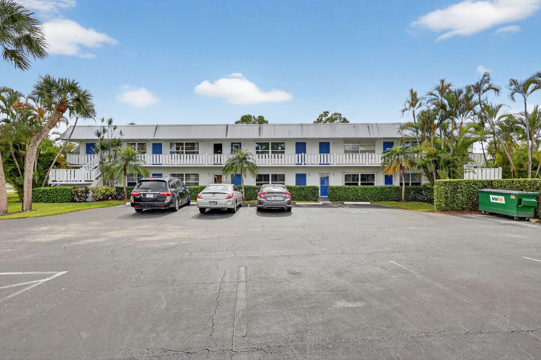 2929 Southeast Ocean Boulevard, Unit J10 Stuart, FL 34996 - Photo 2 of 29 a car parked in front of a building