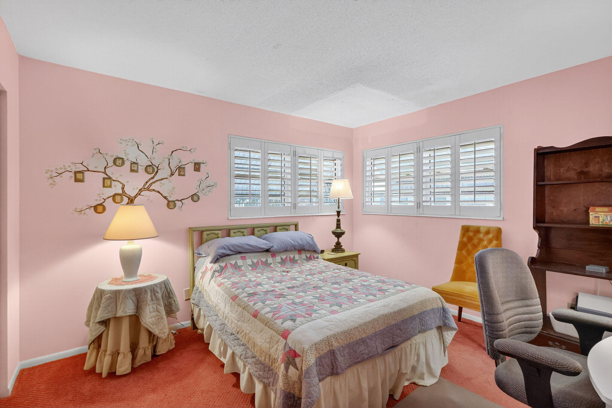 2929 Southeast Ocean Boulevard, Unit J10 Stuart, FL 34996 - Photo 21 of 29 a bedroom with a bed and a table