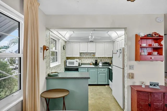 a kitchen with cabinets and appliances