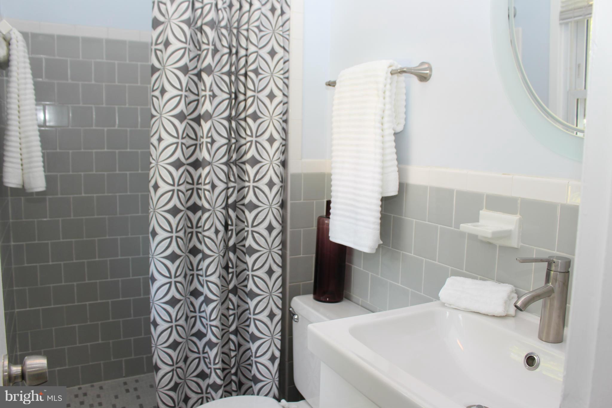 6218 Tyner Street Springfield, VA 22152 - Photo 14 of 30 Updated vanity and neutral en-suite bathroom